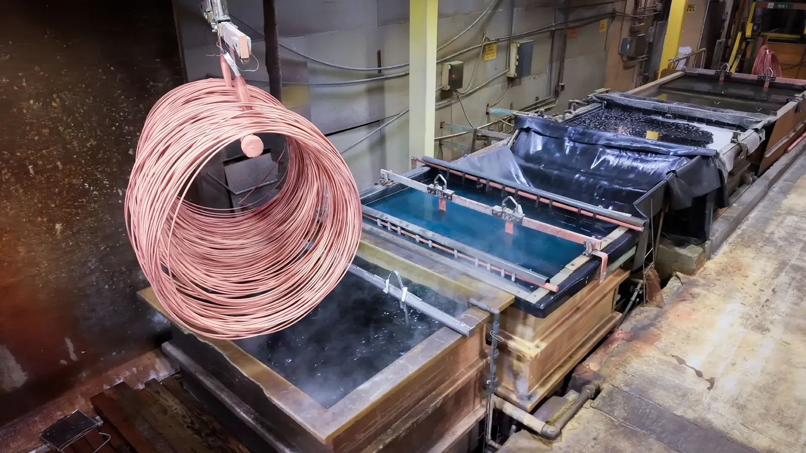 A copper-coated coil suspended over the coating line tanks at Brown Pacific